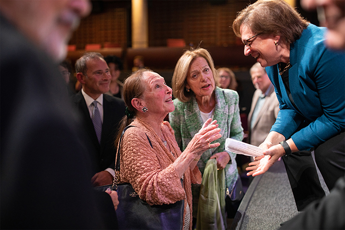 Rosalie Abella and Elena Kagan stop to chat at the edge of the stage (photo by Nick Iwanyshyn)
