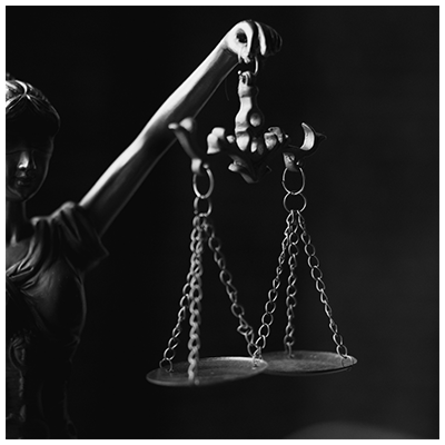 Lady Justice holding the scales (photo via Canva)
