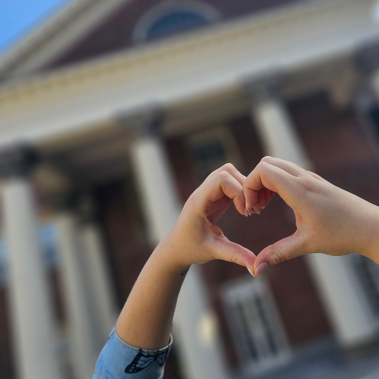 Heart hands in front of Flavelle House